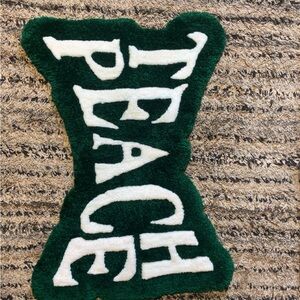 Green and White 'Teach Peace' Rug